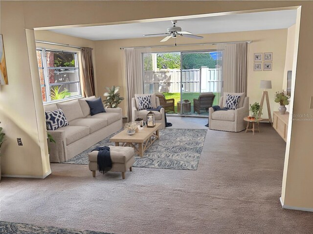 living room featuring ceiling fan and carpet