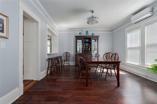 dining area featuring ornamental molding, dark hardwood / wood-style floors, and a wall unit AC