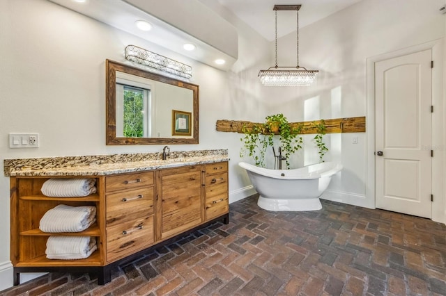 bathroom with a bathtub and vanity