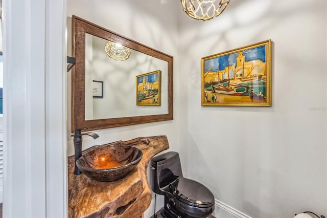 bathroom featuring toilet and sink