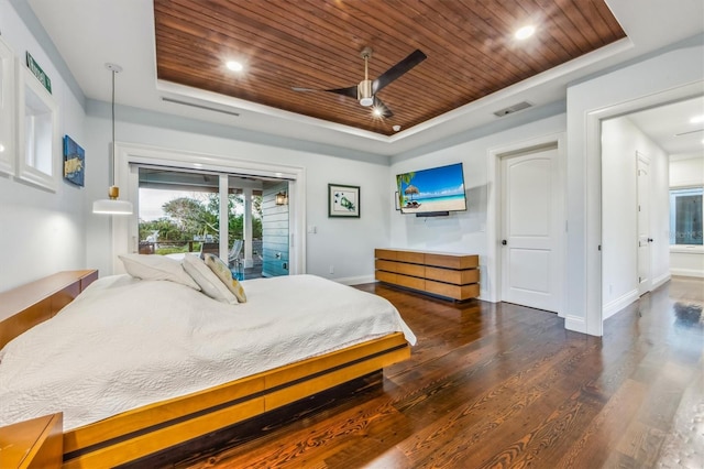 bedroom featuring a raised ceiling, wood ceiling, ceiling fan, and dark wood-type flooring