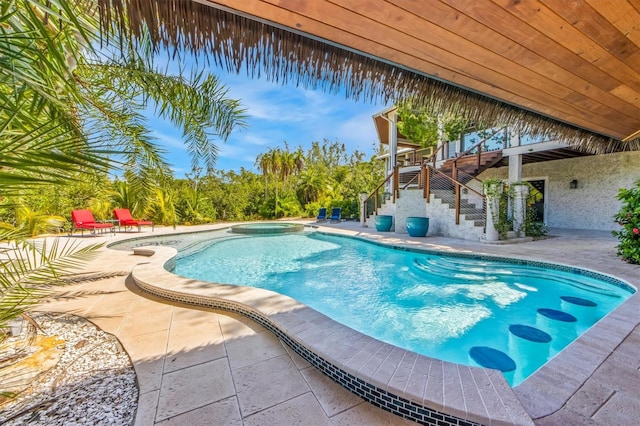 view of swimming pool with a patio area