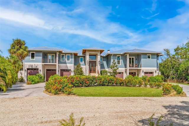 view of front of house featuring a front yard and a garage