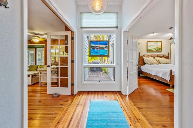 entryway with ceiling fan and light wood-type flooring