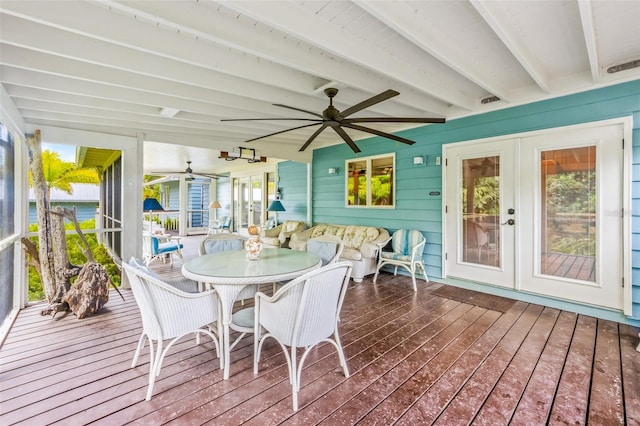 sunroom with french doors, beam ceiling, and ceiling fan