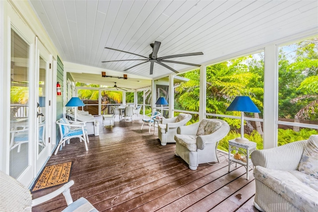 sunroom featuring wooden ceiling and ceiling fan