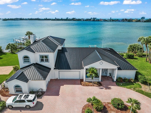 birds eye view of property featuring a water view