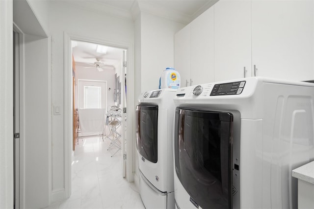 laundry area with ceiling fan, light tile floors, ornamental molding, cabinets, and separate washer and dryer