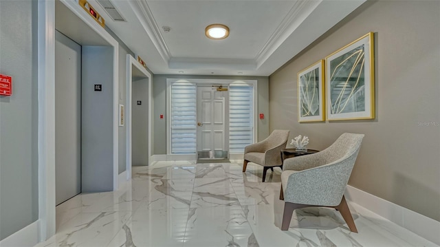 401 N Point Rd Unit 901, Osprey, FL 34229 - hall with elevator, a tray ceiling, ornamental molding, marble finish floors, and baseboards