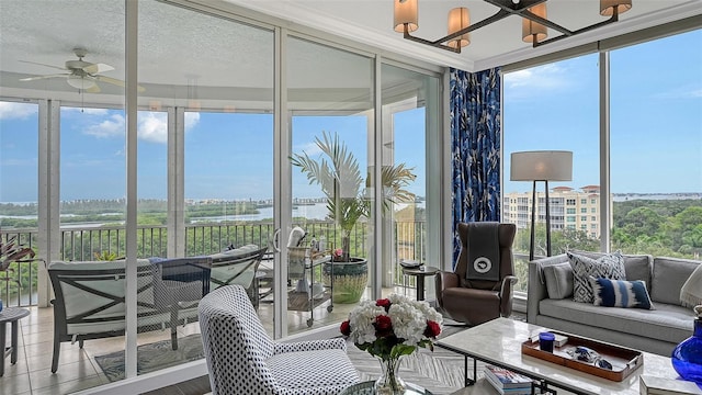 sunroom / solarium with plenty of natural light and ceiling fan