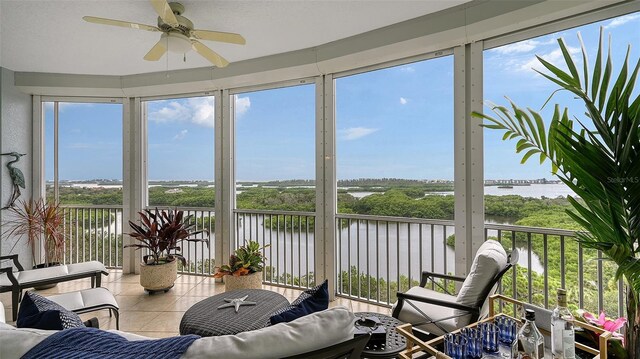 401 N Point Rd Unit 901, Osprey, FL 34229 - sunroom / solarium with a water view and tile patterned floors