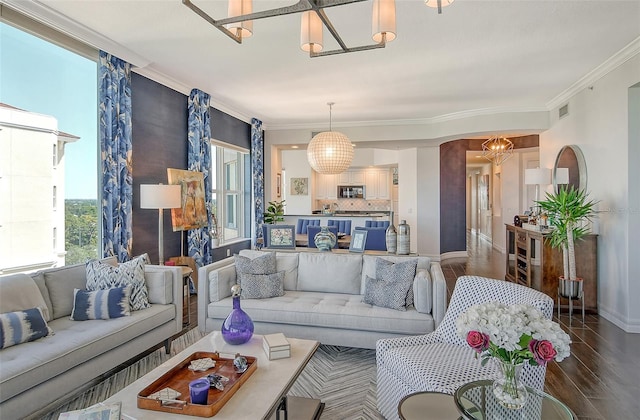 living room with hardwood / wood-style flooring and ornamental molding