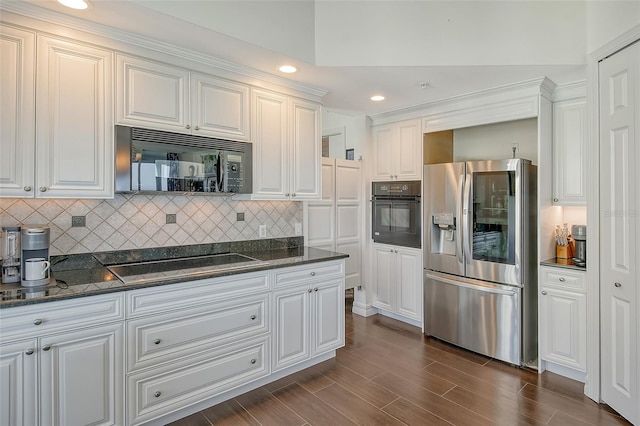 kitchen with dark hardwood / wood-style floors, dark stone countertops, black appliances, white cabinetry, and tasteful backsplash