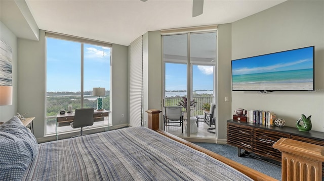 carpeted bedroom with access to outside, multiple windows, and ceiling fan