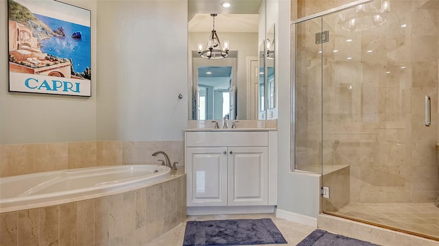 bathroom with vanity, an inviting chandelier, separate shower and tub, and tile patterned flooring