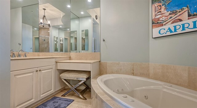 bathroom with vanity, a chandelier, plus walk in shower, and tile patterned flooring