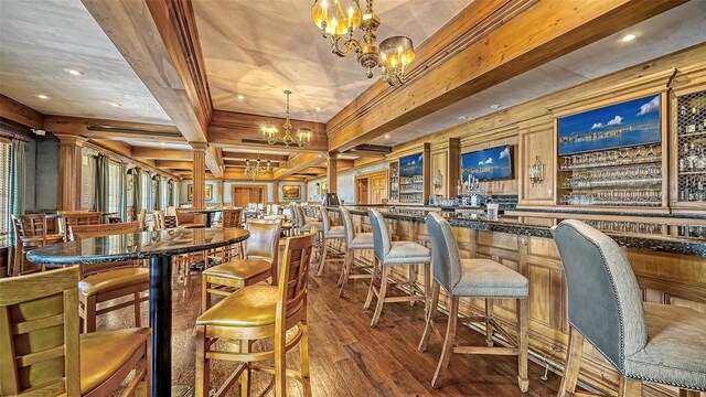 401 N Point Rd Unit 901, Osprey, FL 34229 - bar area featuring a chandelier, hardwood / wood-style floors, recessed lighting, beam ceiling, and ornate columns