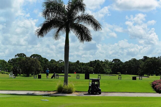 401 N Point Rd Unit 901, Osprey, FL 34229 - view of property's community with a yard and view of wooded area