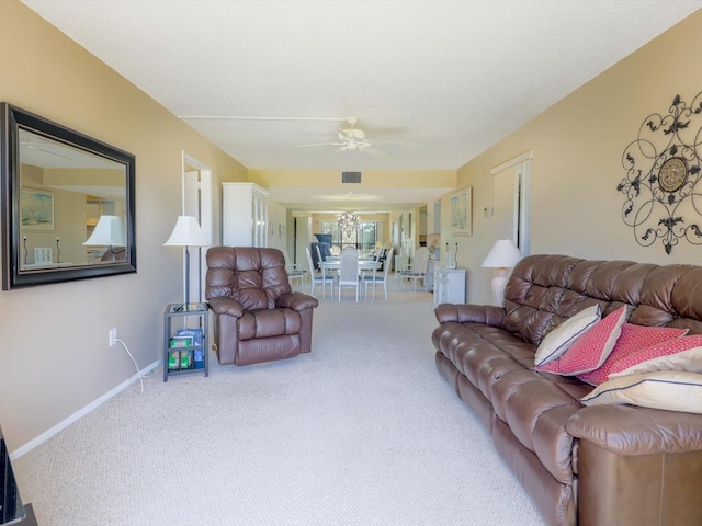 living room featuring carpet flooring and ceiling fan