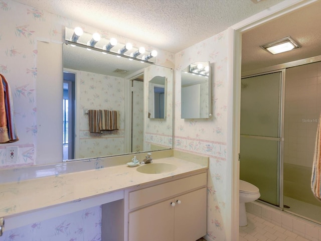 bathroom featuring walk in shower, toilet, tile flooring, a textured ceiling, and large vanity