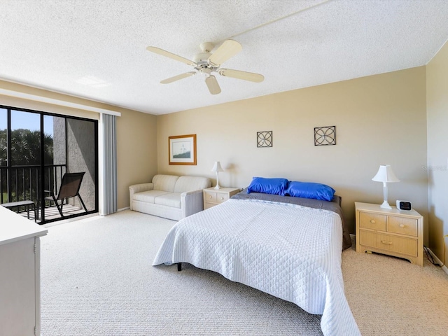 carpeted bedroom featuring a textured ceiling, access to exterior, and ceiling fan