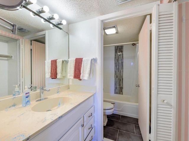 full bathroom with shower / bath combo, tile floors, a textured ceiling, vanity with extensive cabinet space, and toilet