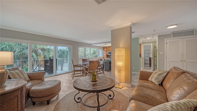 living room with ornamental molding and light tile flooring