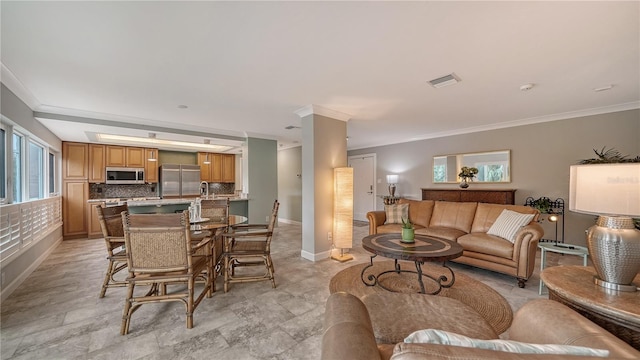 living room featuring ornamental molding and light tile floors