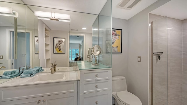 bathroom with toilet and vanity