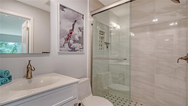 bathroom with an enclosed shower, toilet, and vanity