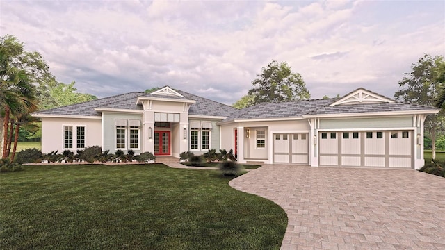 view of front of home with a front lawn, a garage, and french doors