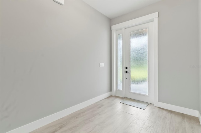 doorway to outside with light hardwood / wood-style floors