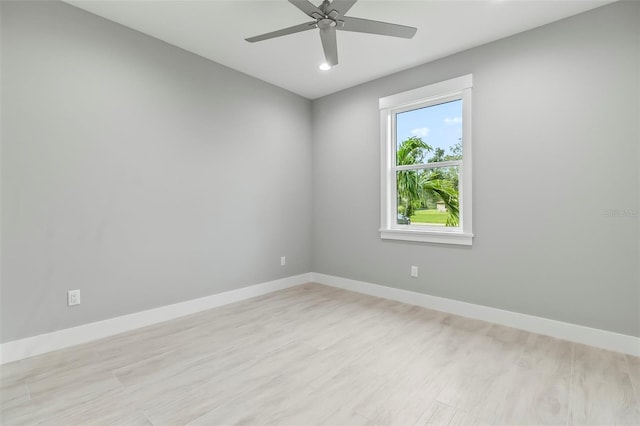 empty room featuring light hardwood / wood-style floors and ceiling fan