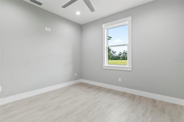 unfurnished room featuring ceiling fan and light wood-type flooring