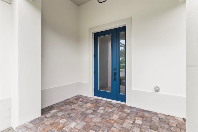 doorway to property featuring french doors