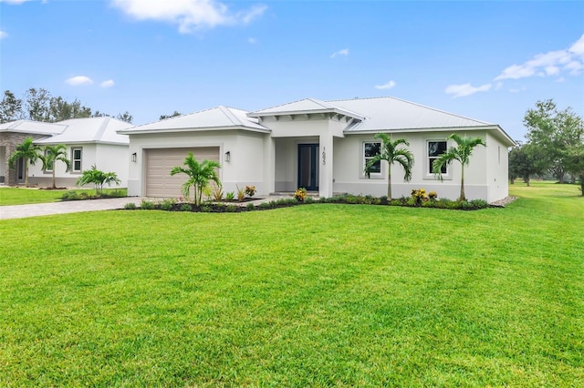 view of front of house with a front lawn and a garage