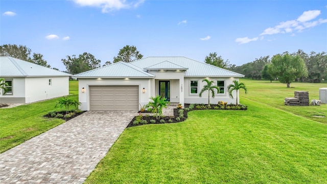 view of front facade featuring a front lawn and a garage