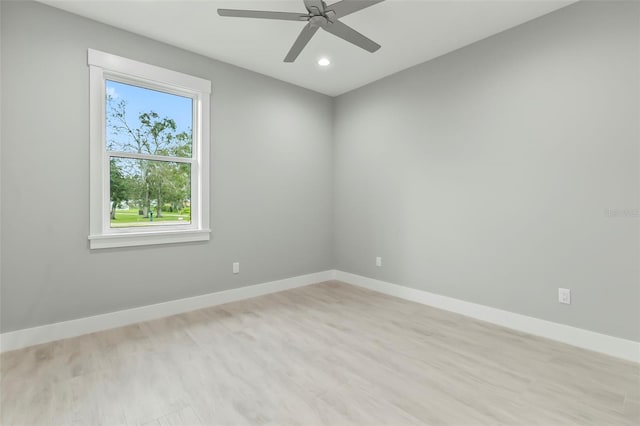 empty room with light hardwood / wood-style floors and ceiling fan