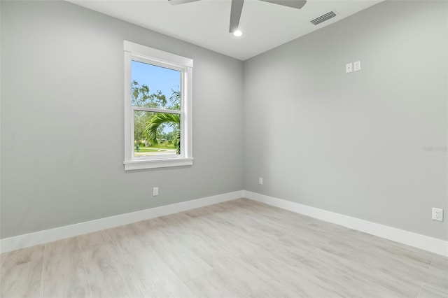 empty room with light hardwood / wood-style floors and ceiling fan