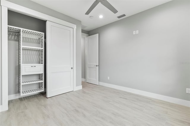 unfurnished bedroom featuring a closet, ceiling fan, and light wood-type flooring