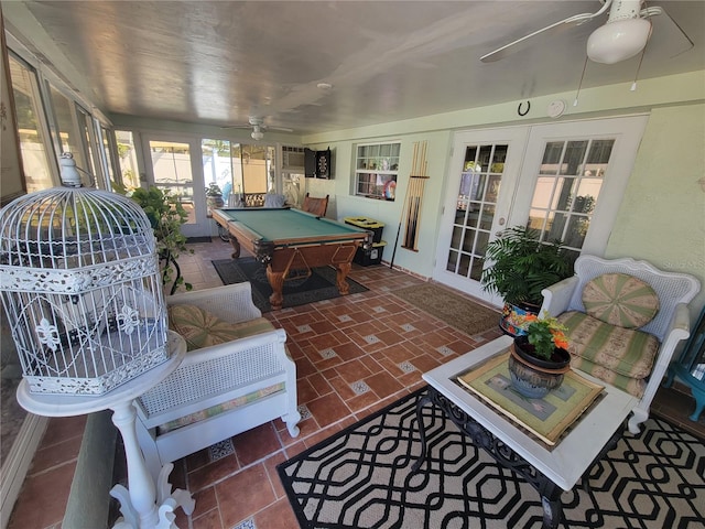 playroom with french doors, dark tile floors, ceiling fan, and pool table