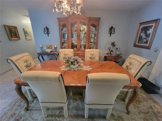tiled dining room with an inviting chandelier