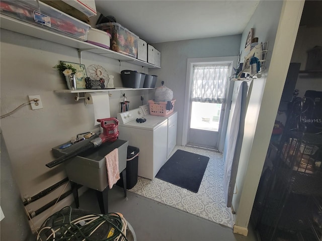 washroom featuring sink and washing machine and clothes dryer