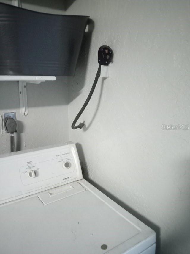 laundry area with washer / dryer