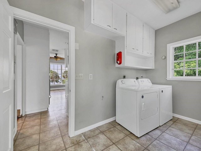 clothes washing area with washer and dryer, ceiling fan, and light tile flooring