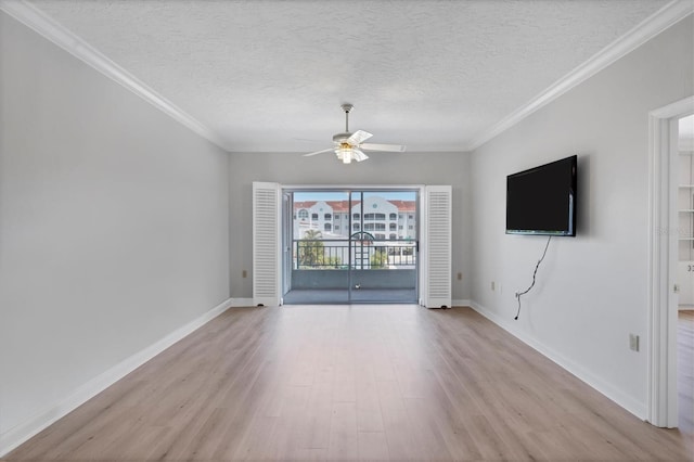 unfurnished room featuring ceiling fan, a textured ceiling, and light wood-type flooring