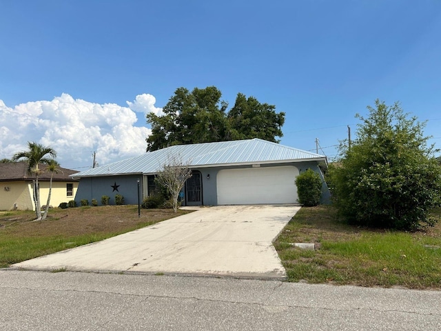 single story home featuring a garage