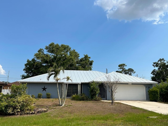 single story home featuring a front yard and a garage