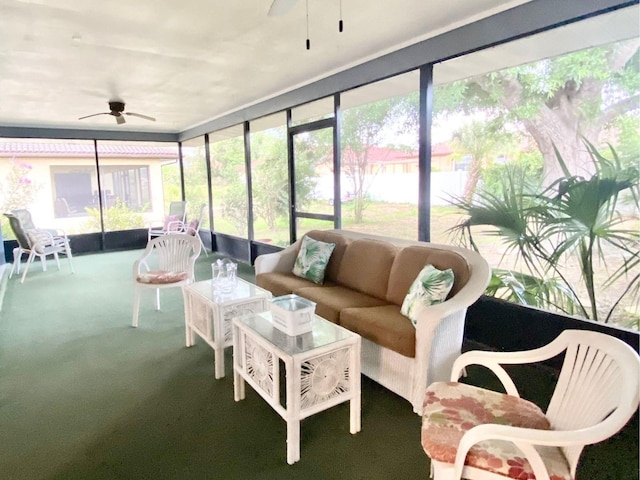 sunroom / solarium featuring ceiling fan