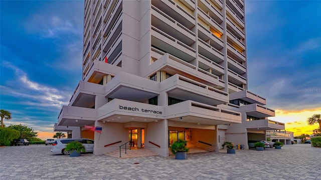 view of outdoor building at dusk